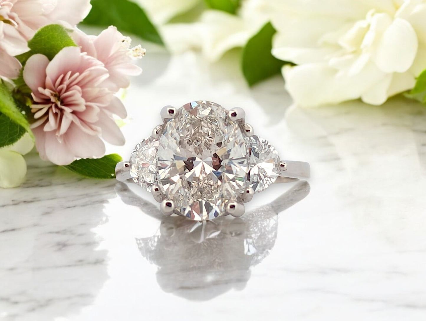 14k white gold engagement ring with 3.02 ctw oval lab diamond center and .80 ctw side stones, IGI VS2 F
