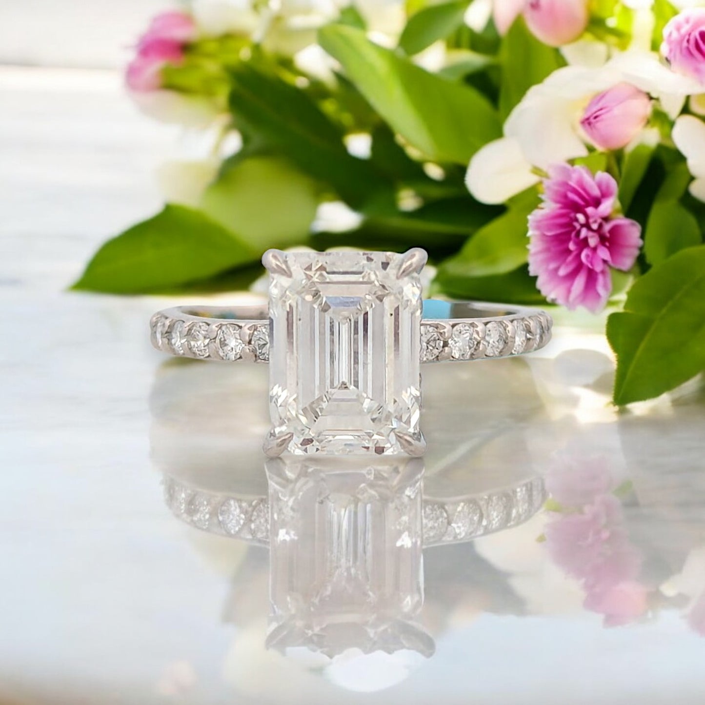 14k white gold engagement ring with 3.12 ctw emerald cut lab diamond, .43 ctw on shank, hidden halo, IGI VS2 E