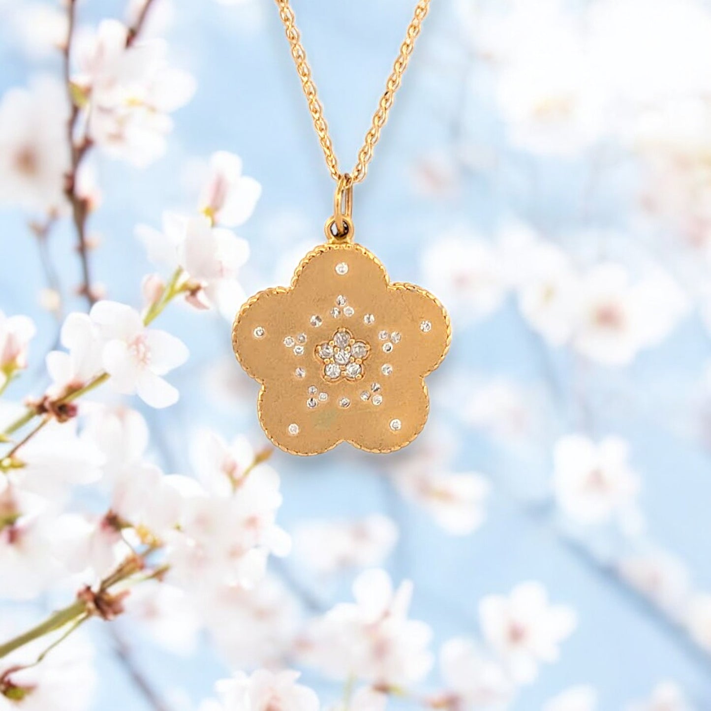14k yellow gold necklace with flower pendant featuring .25 ctw round lab diamonds and lobster clasp