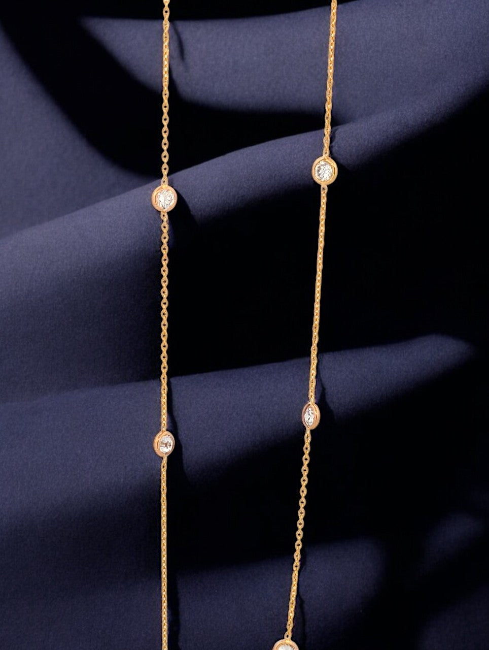 14k yellow gold necklace with 11 round lab diamonds totaling 1.5 ctw, stationed 1 1/4" apart