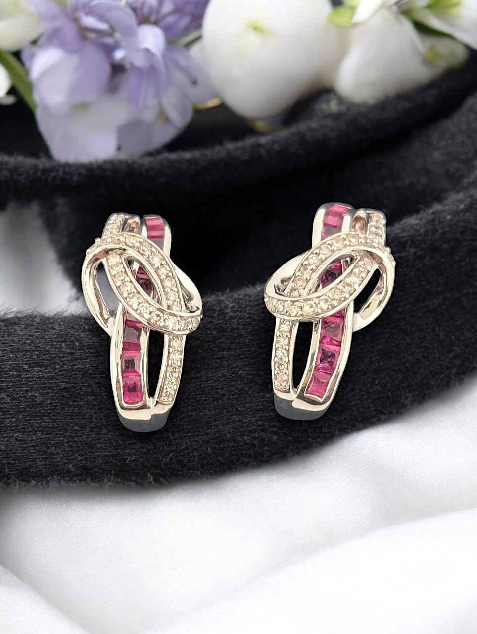 14k white gold J hook earrings with princess cut Rubies and .25 ctw Diamonds