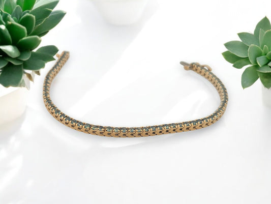 14k yellow gold tennis bracelet with 2.39 carat vibrant Tanzanite gemstones