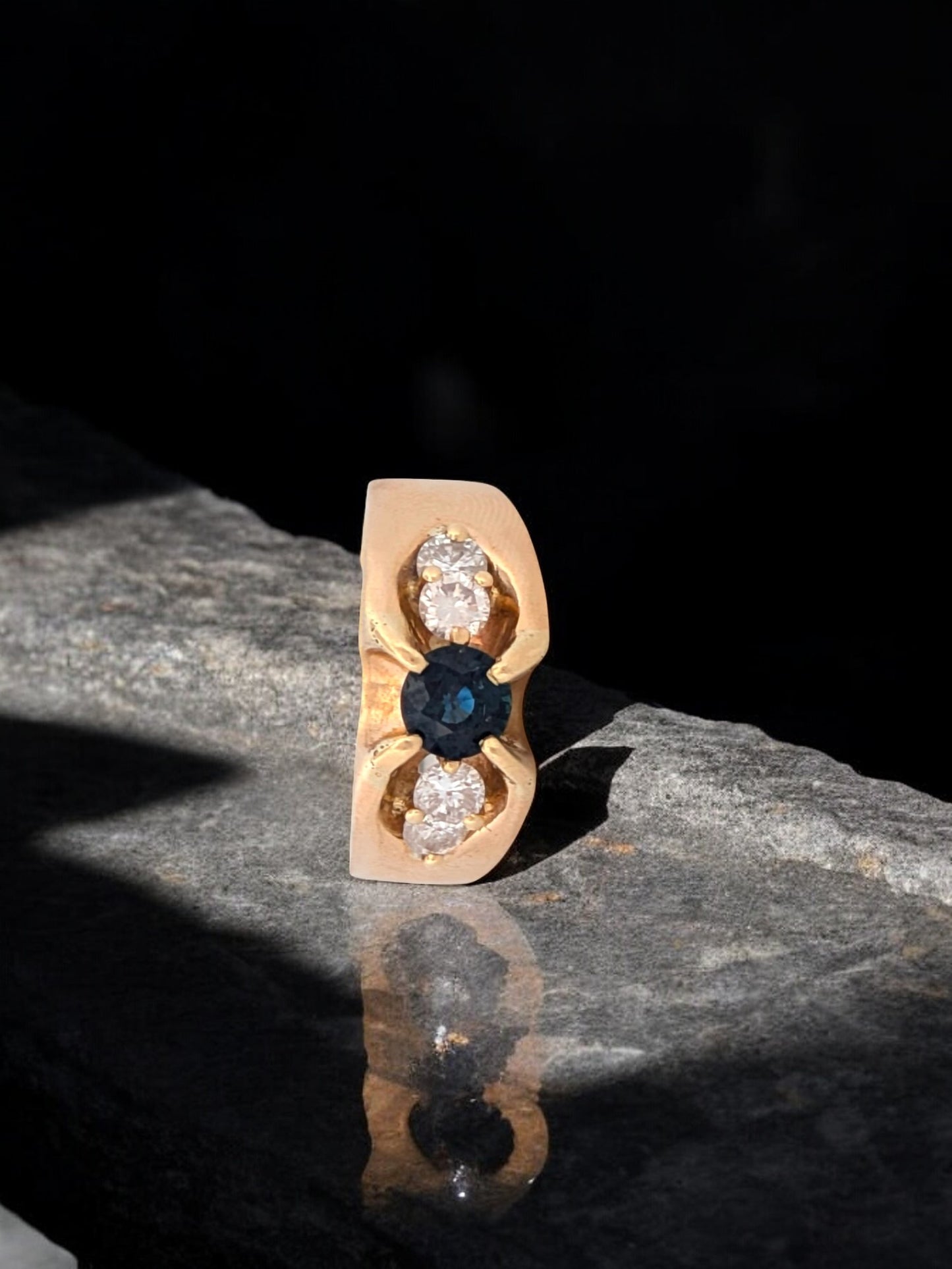 Wendy | 14k yellow gold ring with a natural saphpire and diamond accents on either side. 7.5