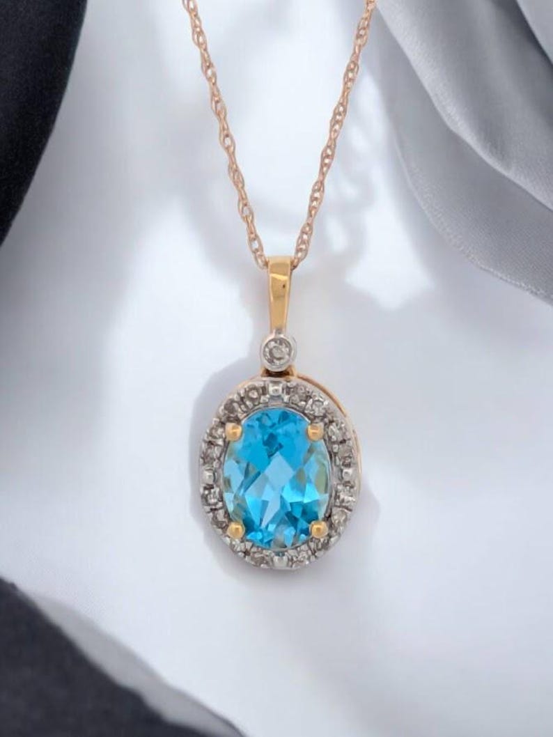 Iris | 10k Yellow Gold Necklace | 1.46 CTW Swiss Blue Topaz & Diamond Halo Pendant | 18" Oval Topaz Necklace