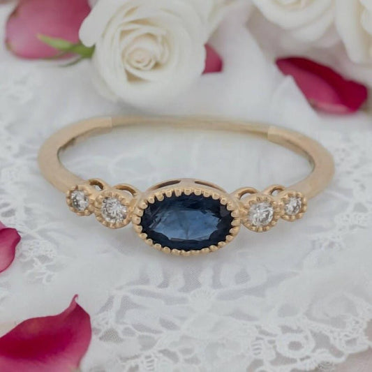 Nora | 14k White Gold Ring with .65 Carat Natural Blue Sapphire in East/West Setting | Bezel Set Diamond Accents | Unique Sapphire Ring Gift